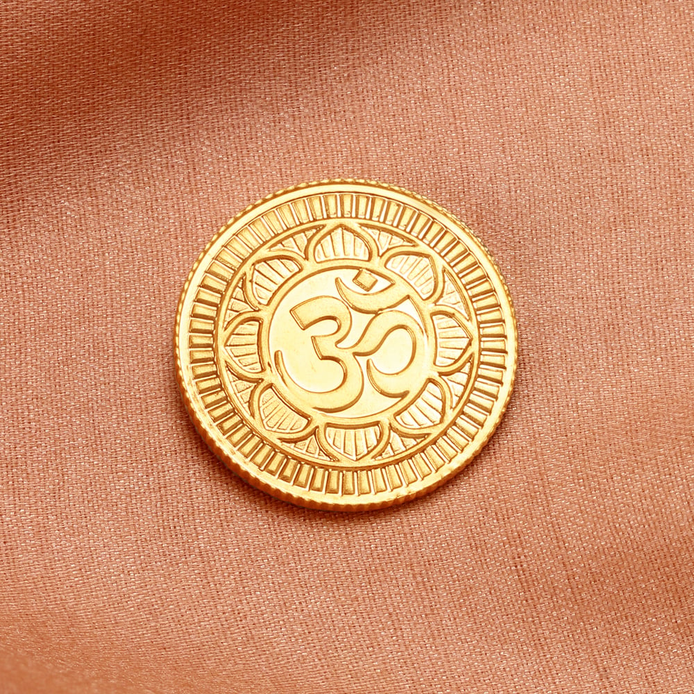 a gold coin with a symbol on it
